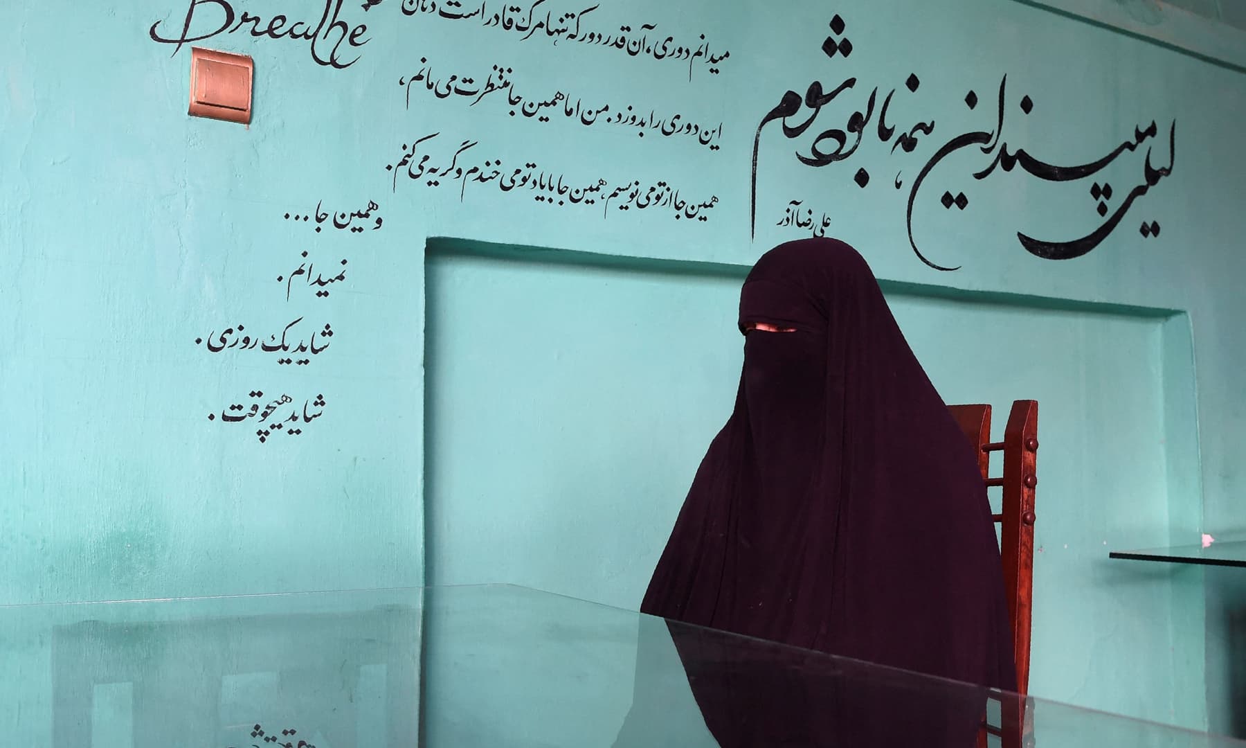 This photo, taken on November 16, 2021, shows Laila, whose name has been changed to protect her identity, speaking during an interview with *AFP* in Kabul. An Afghan mother of six children, she started to beg on the streets after losing her job when her employer fled the country. — AFP