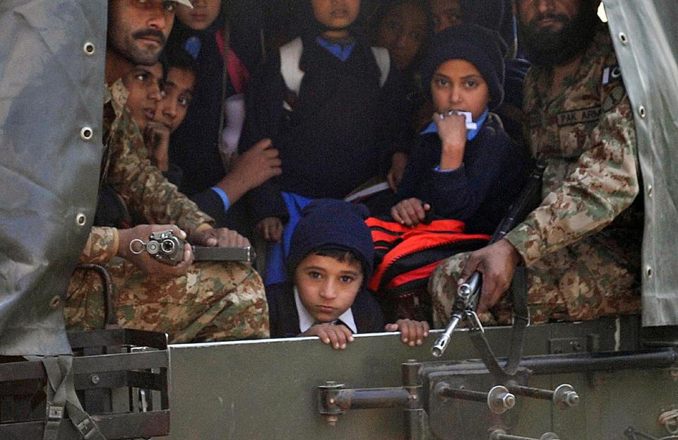 Pakistani-soldiers-transport-rescued-schoolchildren-from-the-site-of-an-attack-by-Taliban-gunmen-on-a-school-in-Peshawar-on-December-16-2014-AFP-PhotoA-Majeed.jpg