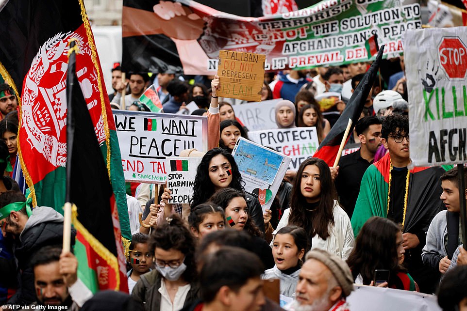 Protesters wielded numerous banners, one of which read 'We Want Peace'. Another said: 'Stop killing Afghans''We Want Peace'. Another said: 'Stop killing Afghans'