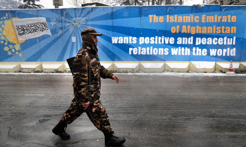 A Taliban fighter walks on a street, in Kabul, Afghanistan, in this Feb 6 file photo. — AP