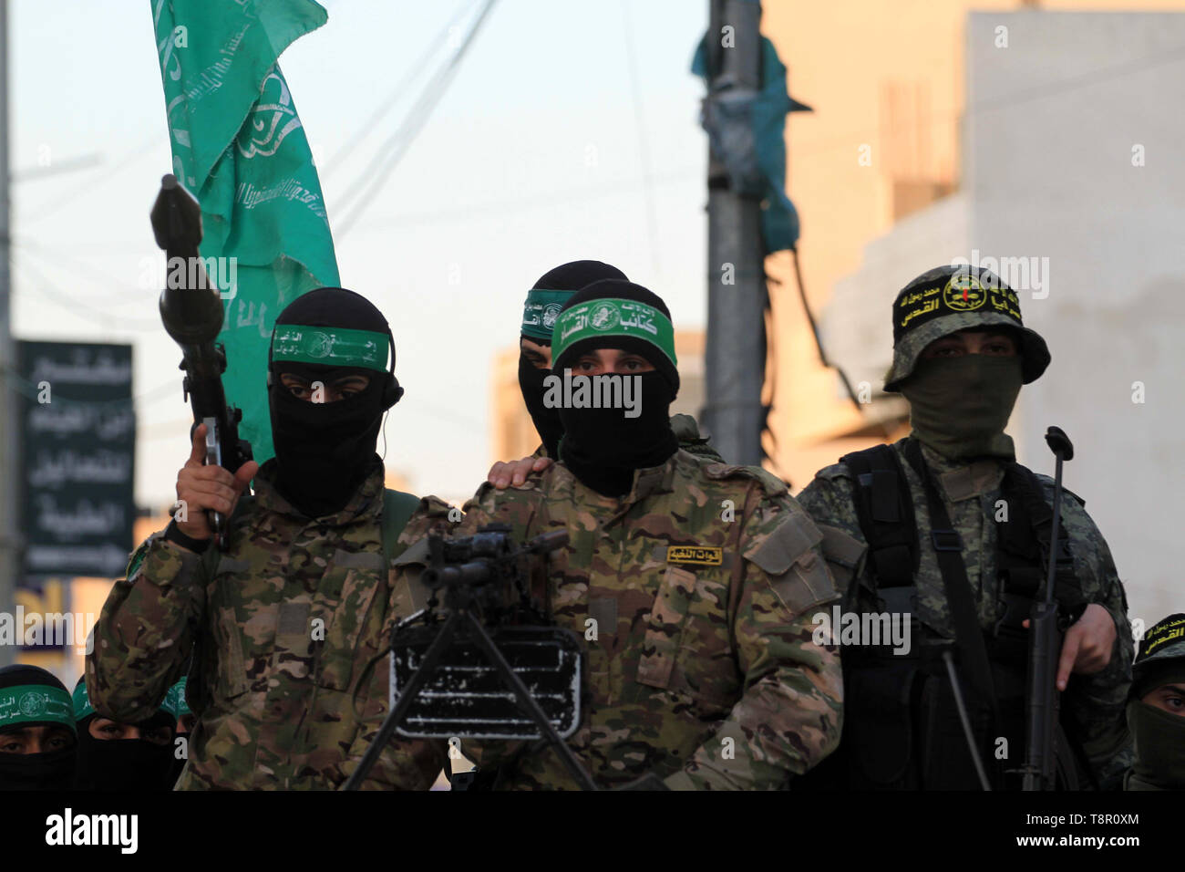 gaza-city-gaza-strip-palestinian-territory-14th-may-2019-palestinian-militants-of-ezzeddin-al-qassam-brigades-loyal-to-hamas-movement-and-al-quds-brigades-loyal-to-islamic-jihad-movement-patrol-in-a-street-in-gaza-city-on-may-14-2019-qatar-will-continue-its-humanitarian-aid-to-the-gaza-strip-for-another-six-months-including-paying-for-electricity-and-helping-poor-families-a-senior-qatari-official-announced-on-tuesday-credit-mahmoud-khattabapa-imageszuma-wirealamy-live-news-T8R0XM.jpg