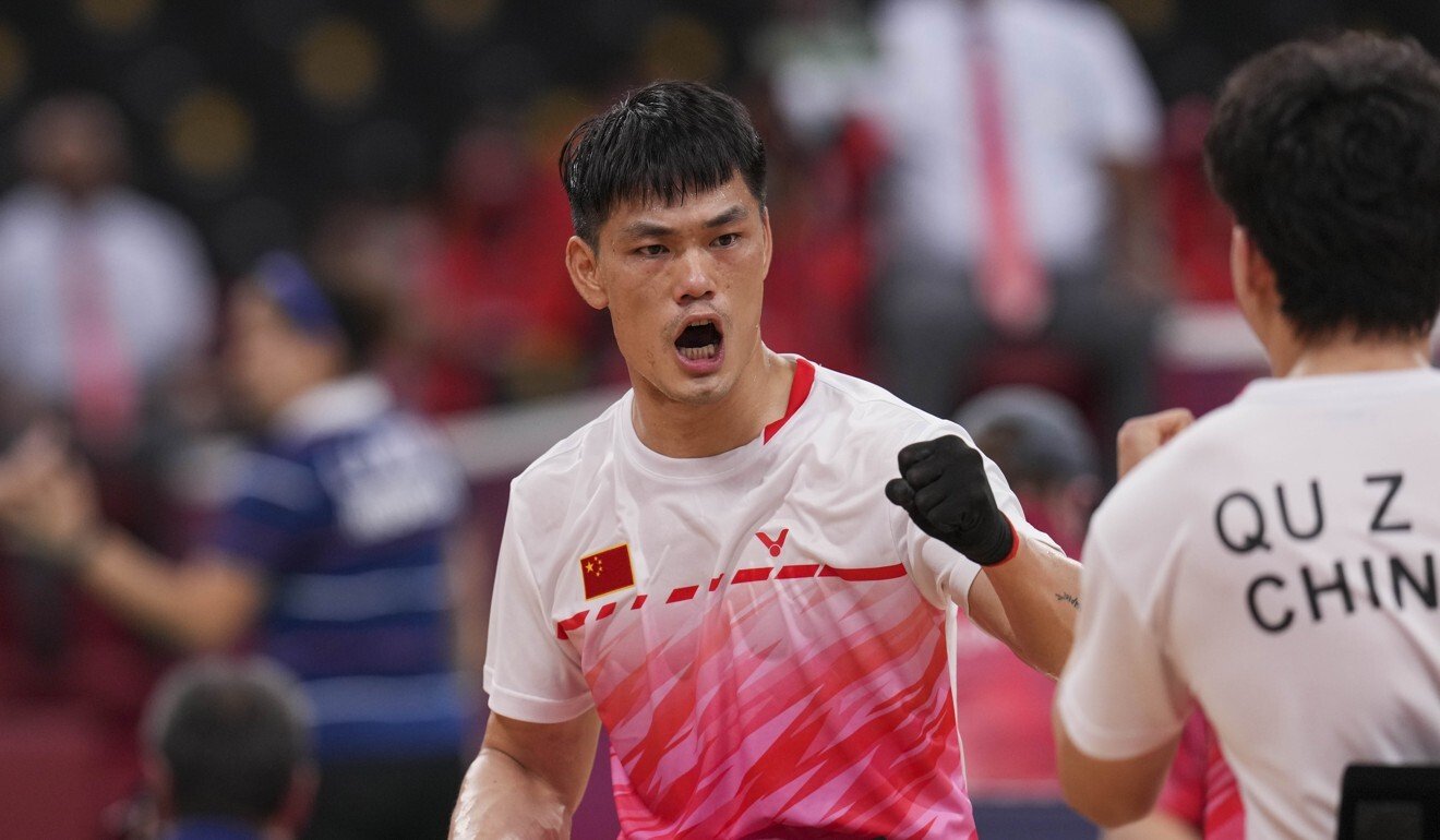 China’s Mai Jianpeng celebrate during the badminton men's doubles WH gold medal match. Photo: Xinhua