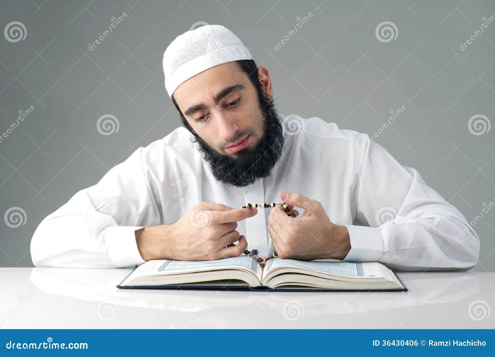 arabian-muslim-man-reading-quran-36430406.jpg