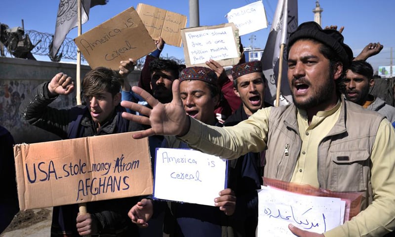Afghan protesters hold placards and shout slogans against US during a protest condemning President Joe Biden's decision, in Kabul, Afghanistan. — AP