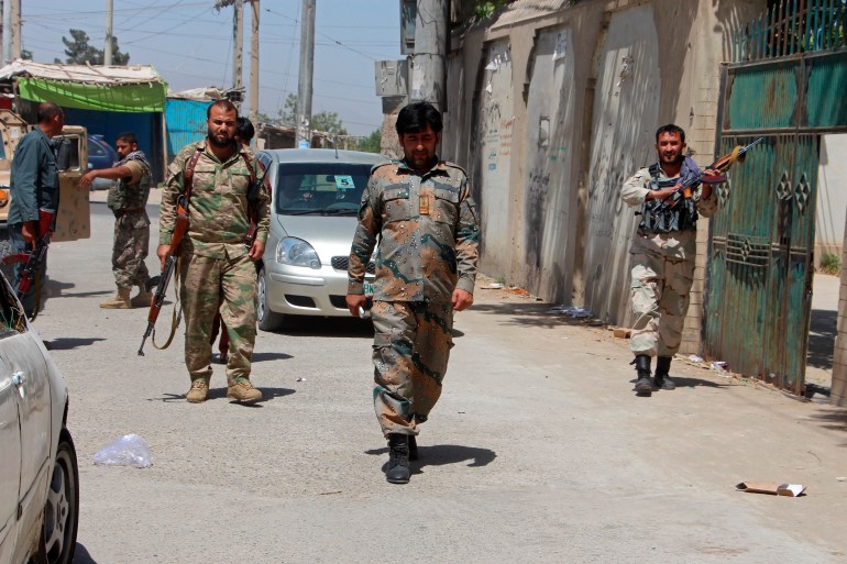 Afghan security personnel patrol during fighting with Taliban in Kunduz city, north of Kabul, Afghanistan [File: Samiullah Quraishi/AP Photo]