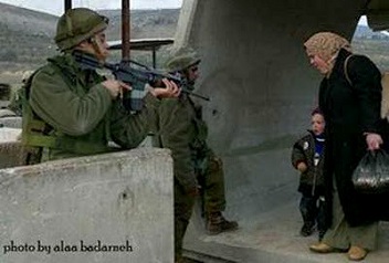 ZIO_Israeli_soldiers_aiming_gun_at_mother_and_child_88.jpg