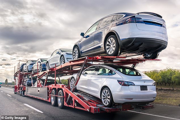 Already this week, Tesla recalled 9,000 Model X  vehicles made in 2016 due to a roof trim that may separate from the car. Pictured, a car transporter carries new Tesla vehicles