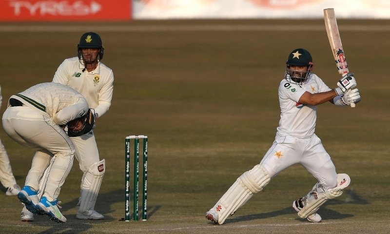Pakistan's Mohammad Rizwan (R) plays a shot as South Africa's wicketkeeper captain Quinton de Kock (2L) watches during the third day of the second Test cricket match on Feb 6. — AFP