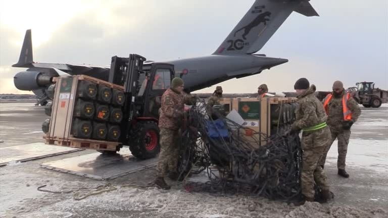 A British military cargo C-17 plane unloads anti-tank weapons in Ukraine