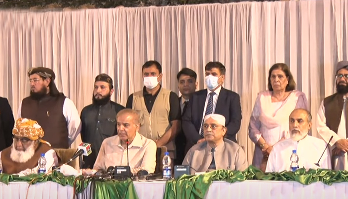 PML-N President Shahbaz Sharif (centre left) address a press conference alongside PDM chief Maulana Fazlur Rehman (left), PPP Co-chairman Asif Ali Zardari (centre right), and BAP Parliamentary Leader Khalid Magsi (right) in Islamabad, on March 28, 2022. — YouTube/HumNewsLive