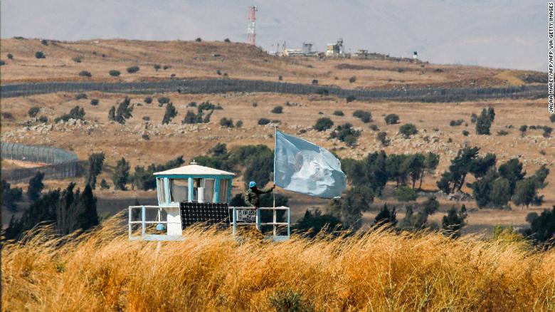 A UN peacekeeper stands on duty at an outpost of the United Nations Disengagement Observer Force (UNDOF) buffer zone between Syria and the Israeli-occupied Golan Heights on August 11, 2020.