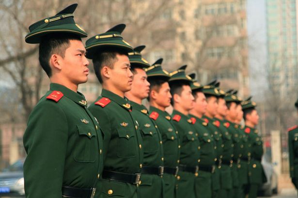 Chinese%20paramilitary%20police,%20wearing%20their%20hats%20up%20side%20down