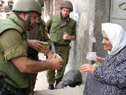 idf-helping-palestinian-woman.jpg