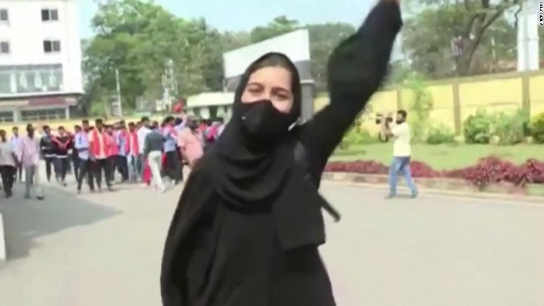 Muskan Khan stands up to a crowd of men holding saffron scarves who heckled her at the school gates. 