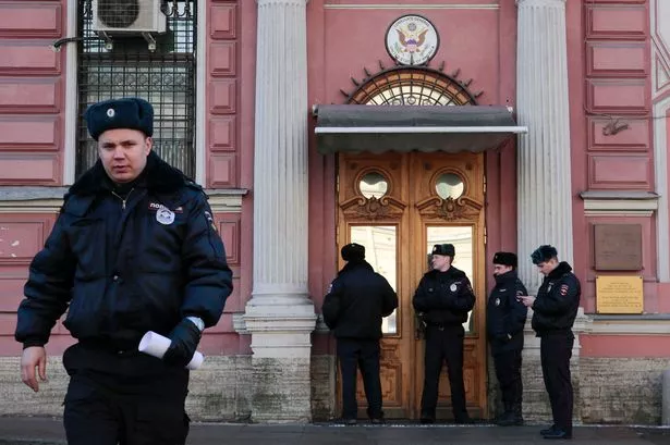 Policemen-stand-guard-outside-the-building-of-the-consulate-general-of-the-US-in-St-Petersburg.jpg