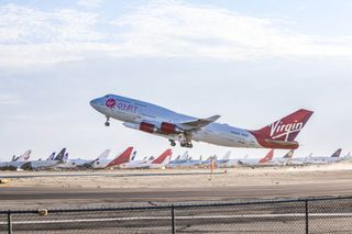 Virgin Orbit's carrier aircraft Cosmic Girl takes off from Mojave Air and Space Port in California with the LauncherOne rocket underwing for the company's Tubular Bells: Part 1 mission on June 30, 2021.