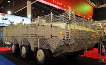 AmSafes-Tarian-RPG-Armour-System-Makes-Middle-Eastern-Debut-at-IDEX-2013-Image-of-Tarian-Fitted-to-PARS-6x6-340x208.jpg