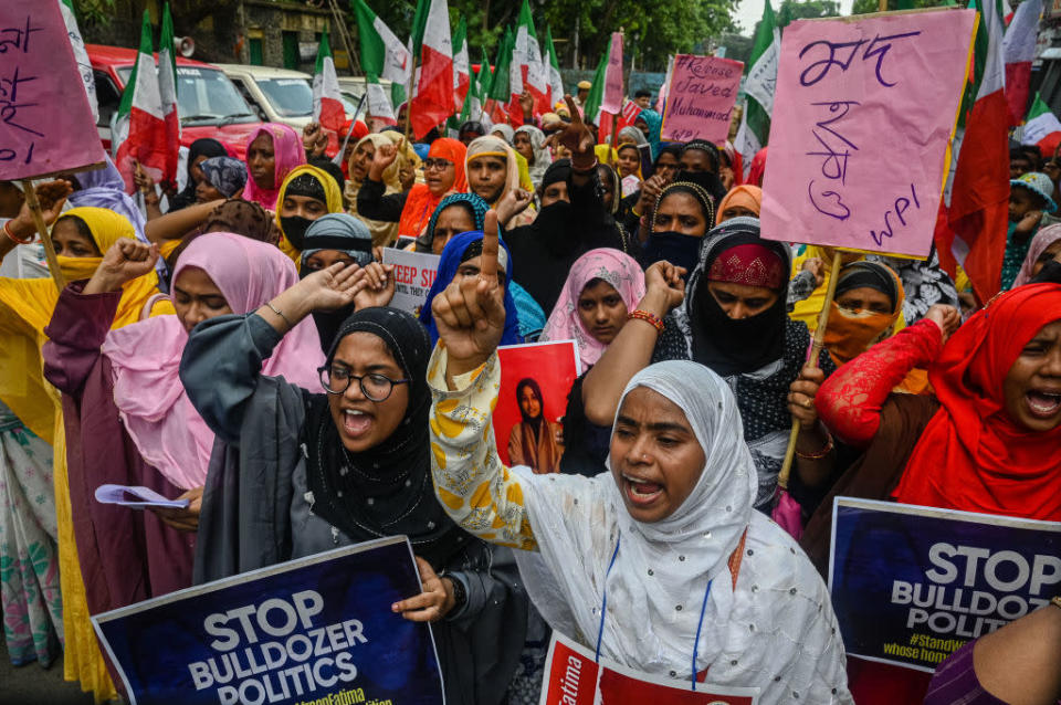 Muslim women shout slogans during a demonstration in support of Muslim activist Afreen Fatima, in Kolkata on June 15, 2022.<span class=copyright>Sankhadeep Banerjee/NurPhoto via Getty Images</span>