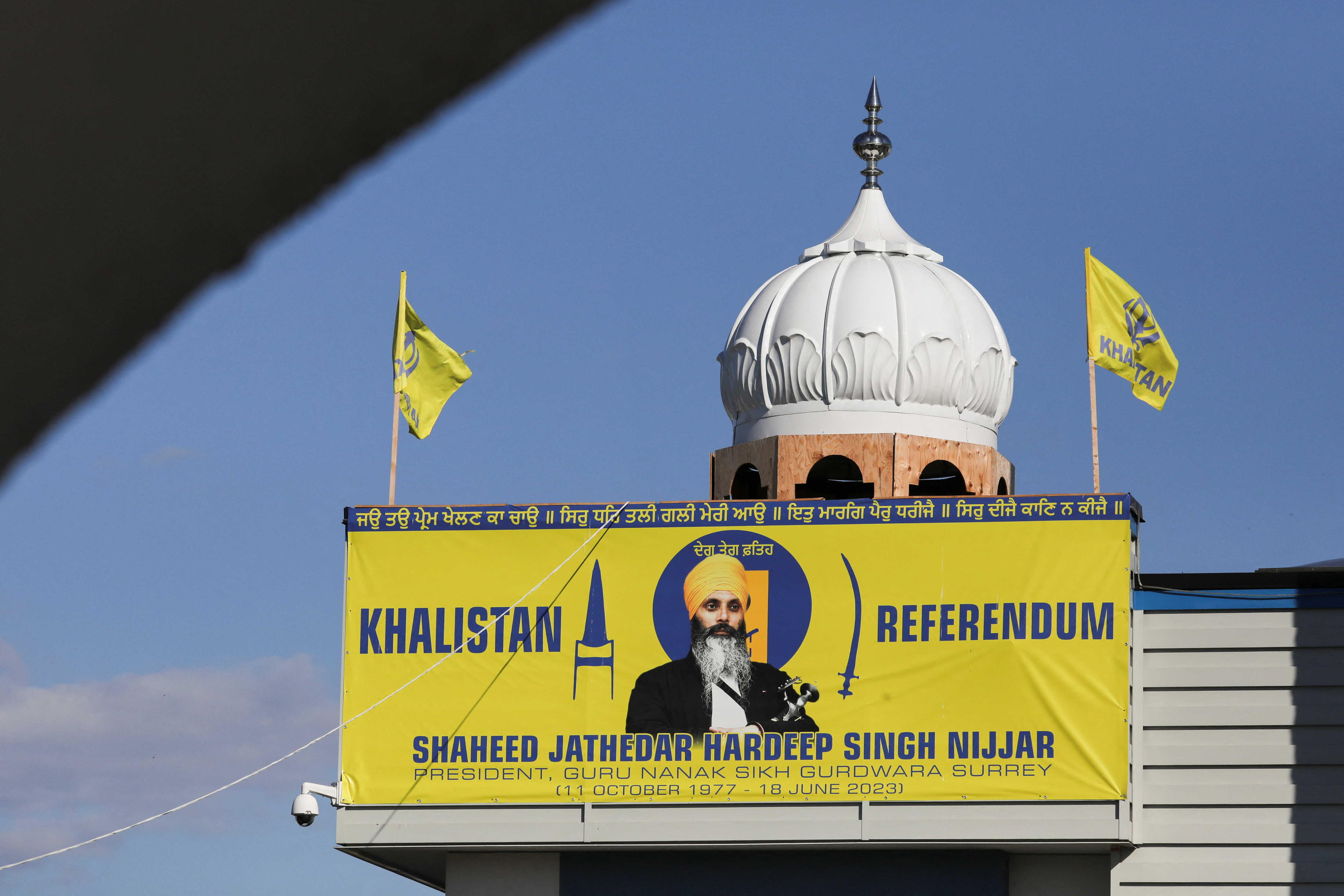 A banner with the image of Sikh leader Hardeep Singh Nijjar is seen at the Guru Nanak Sikh Gurdwara temple, site of his June 2023 killing, in Surrey