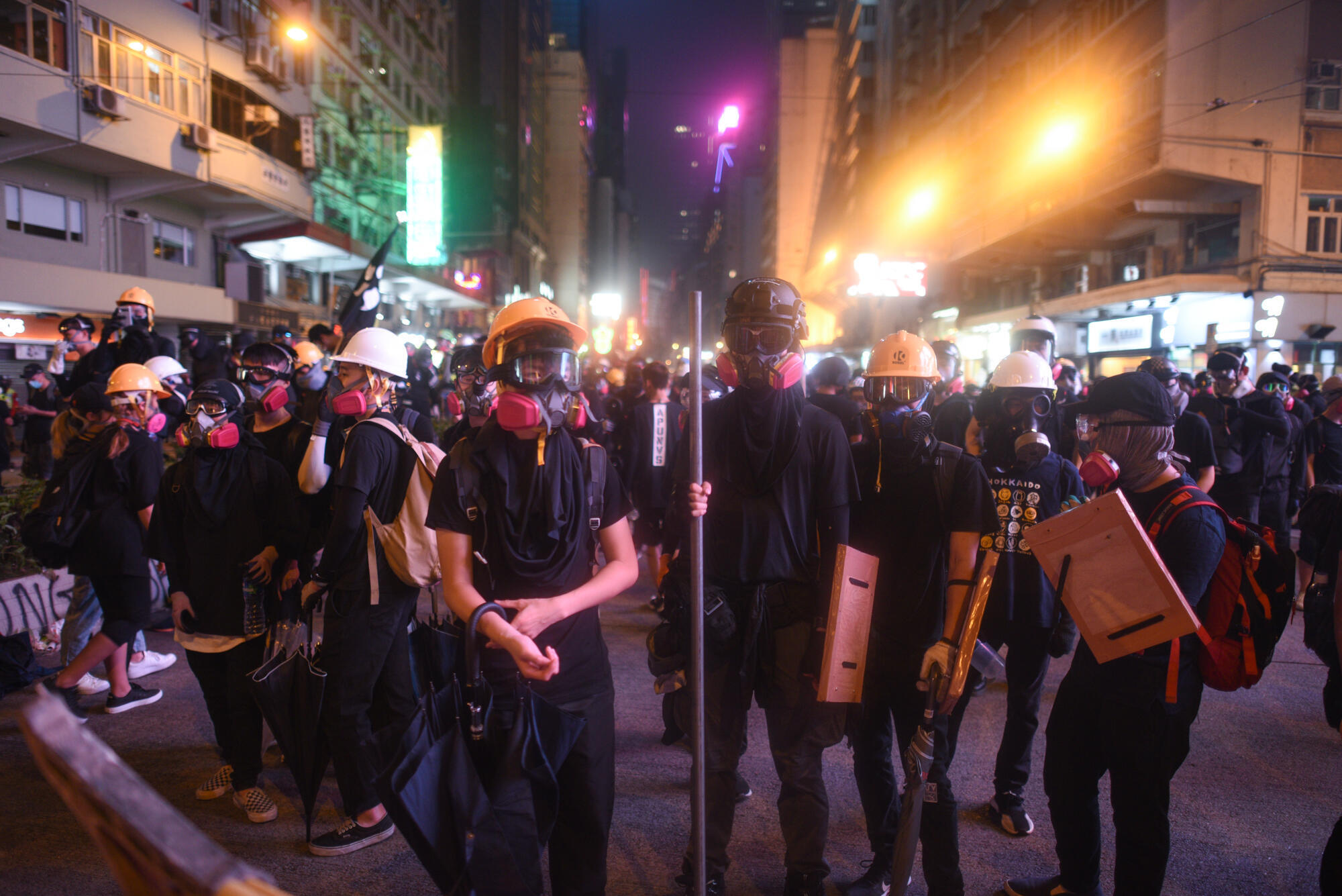 Protesters wear gas masks, helmets and other protective gear at a Hong Kong protest in September 2019.