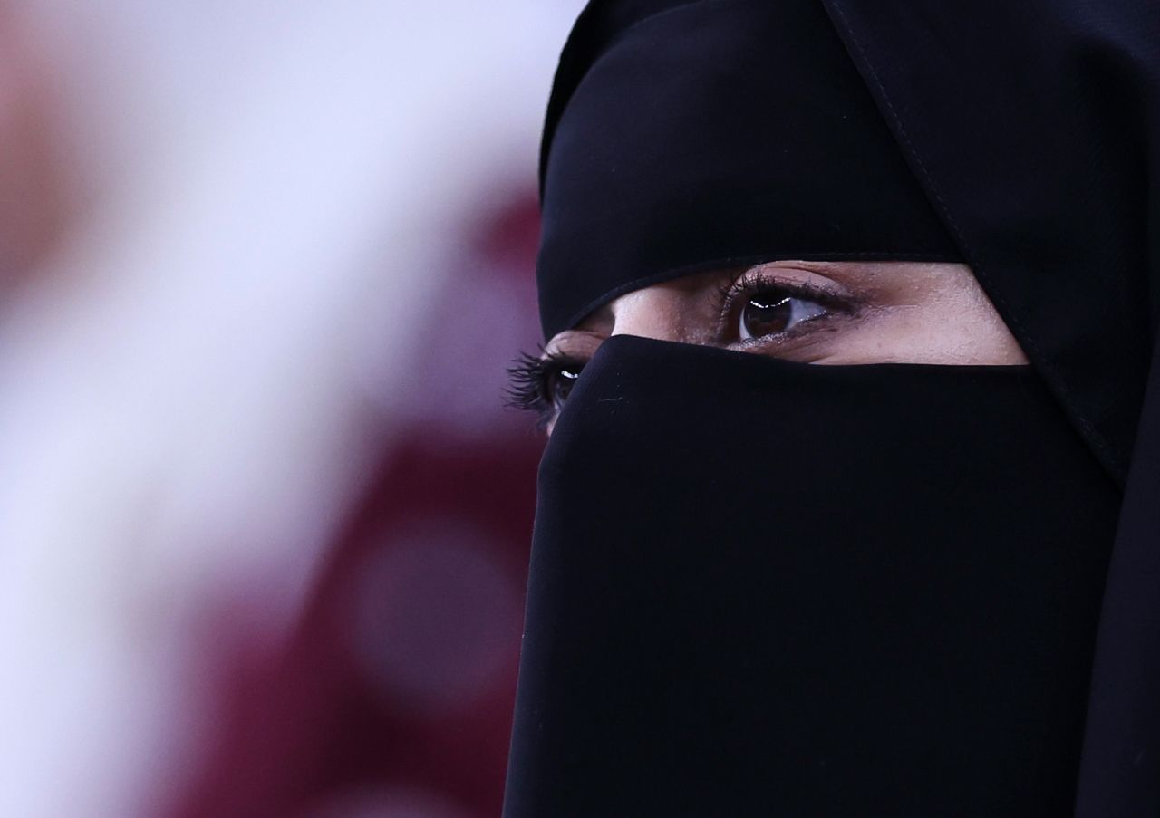 A fan attends the Qatar-Ecuador match on Sunday. Qatar is the first Islamic country to host a World Cup.