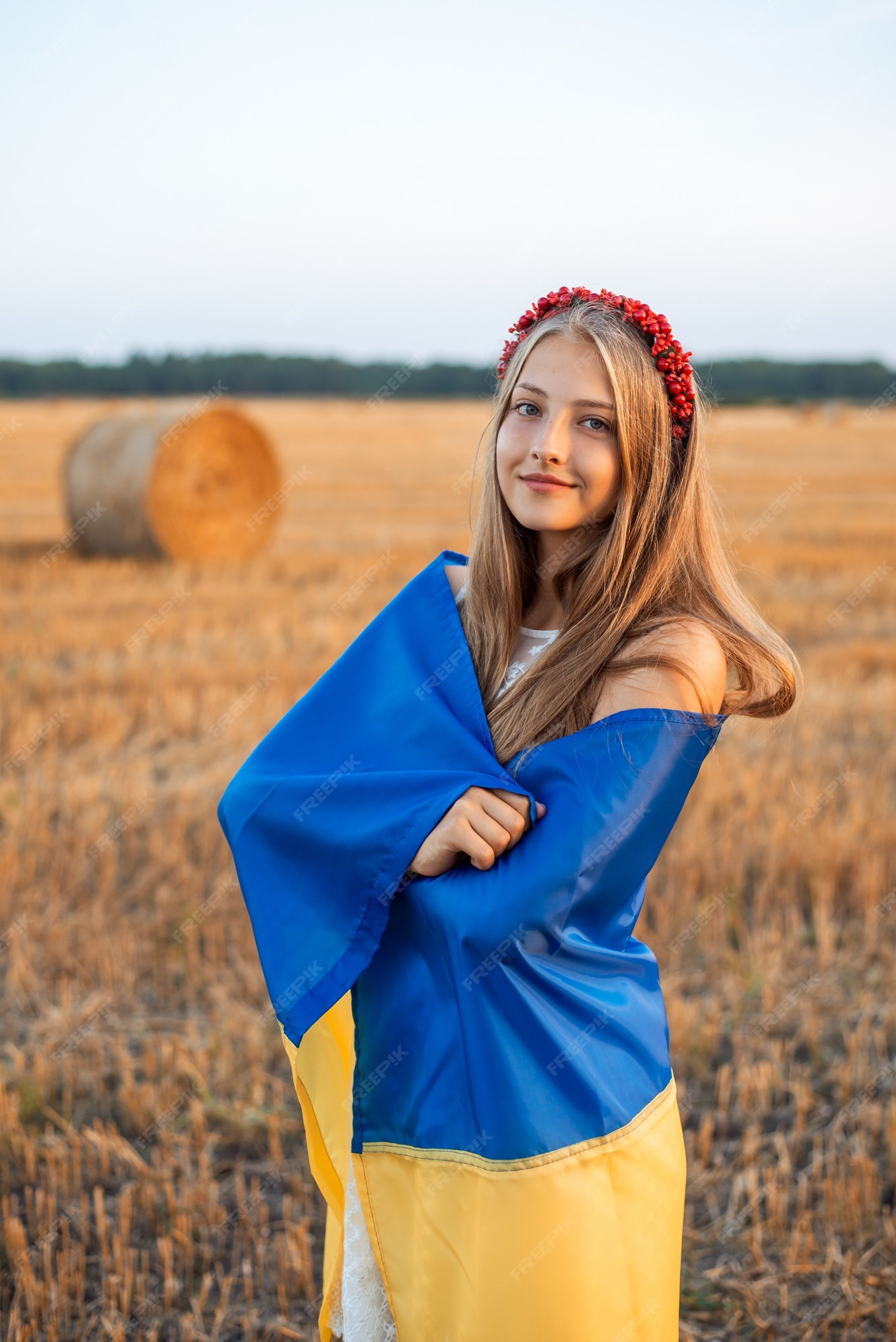 cheerful-ukrainian-girl-wrapped-national-flag-ukraine-agricultural-field_123211-2157.jpg