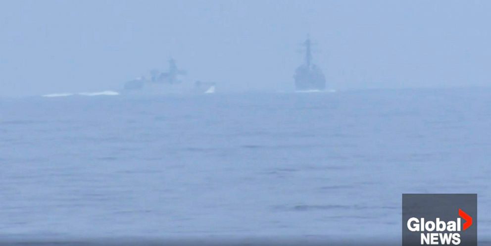 A Chinese warship appears to have intercepted the pair of U.S. and Canadian ships transiting through the Taiwan Strait overnight.