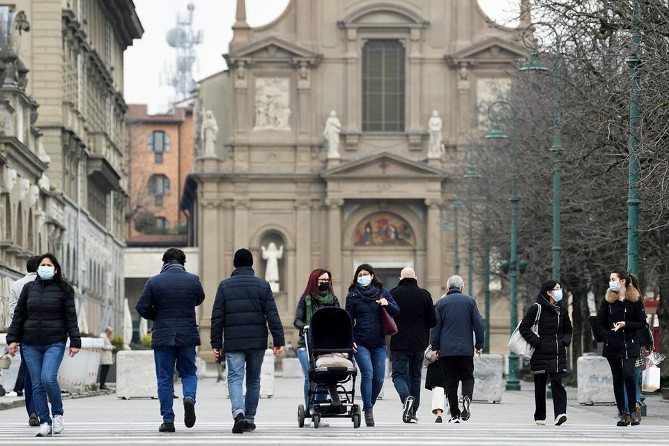 People walk at a street a year after the peak of Italy's coronavirus outbreak in Bergamo on March 3, 2021. — Reuters