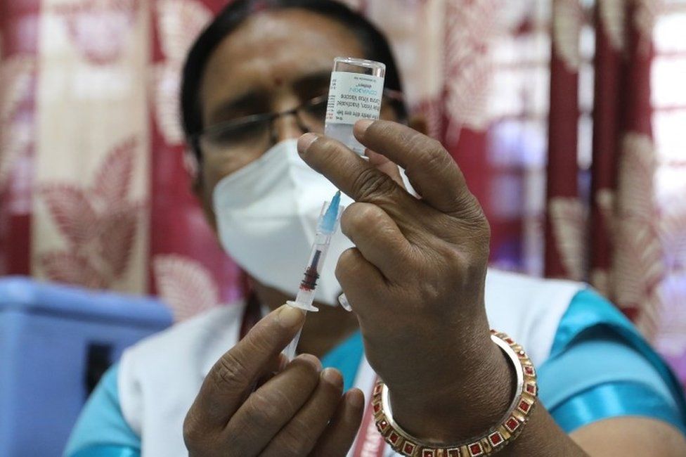 A health worker prepares a shot of Covaxin COVID-19 vaccine developed by Bharat Biotech at the vaccination center in New Delhi, India, 01 April 2021