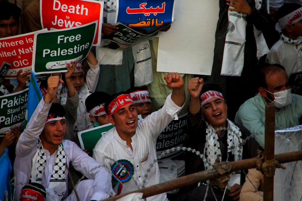 Supporters of the Pakistani religious group, Jamaat-e-Islami, take part in a rally in support of the Palestinian cause, in Peshawar, Pakistan last year