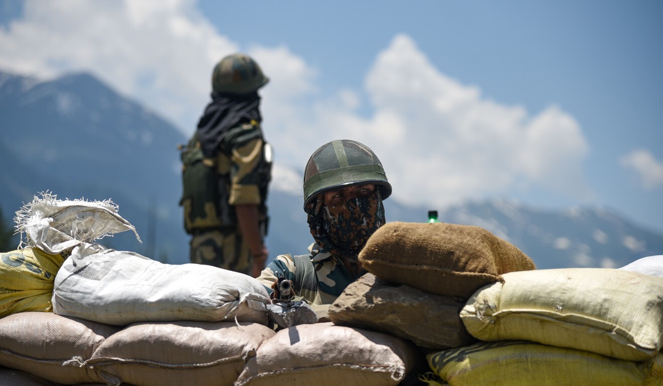 Indian troops guard a highway leading to the Ladakh region, where India and China are locked in a stand-off over the border. Photo: DPA