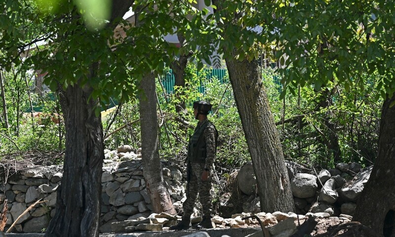 An Indian paramilitary trooper stands guard at Hapatnar in Anantnag district south of occupied Kashmir on April 29. — AFP