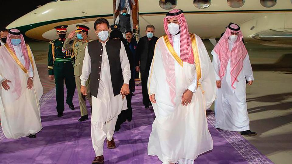 Saudi Crown Prince Mohammed bin Salman, right, meets Pakistan's Prime Minister Imran Khan, at Riyadh international airport, Saudi Arabia, May 7, 2021.