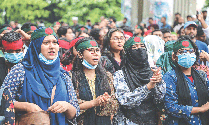 ACTIVISTS take part in a “justice for victims march” in Dhaka, on Friday.—AFP