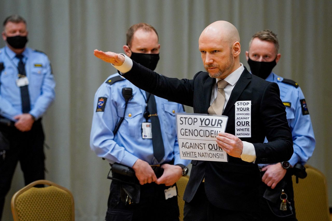 Anders Behring Breivik makes a Nazi salute as he arrives in court on Jan. 18, 2022, in Skien prison, Norway. The mass murderer, who said he was fighting a Muslim invasion in Europe, was sentenced in 2012 to at least 21 years in prison for terror attacks that killed 77 people. Under Norwegian law, Breivik was entitled to a review in court for possible release on parole after serving the initial 10 years of his sentence, but his parole was denied.