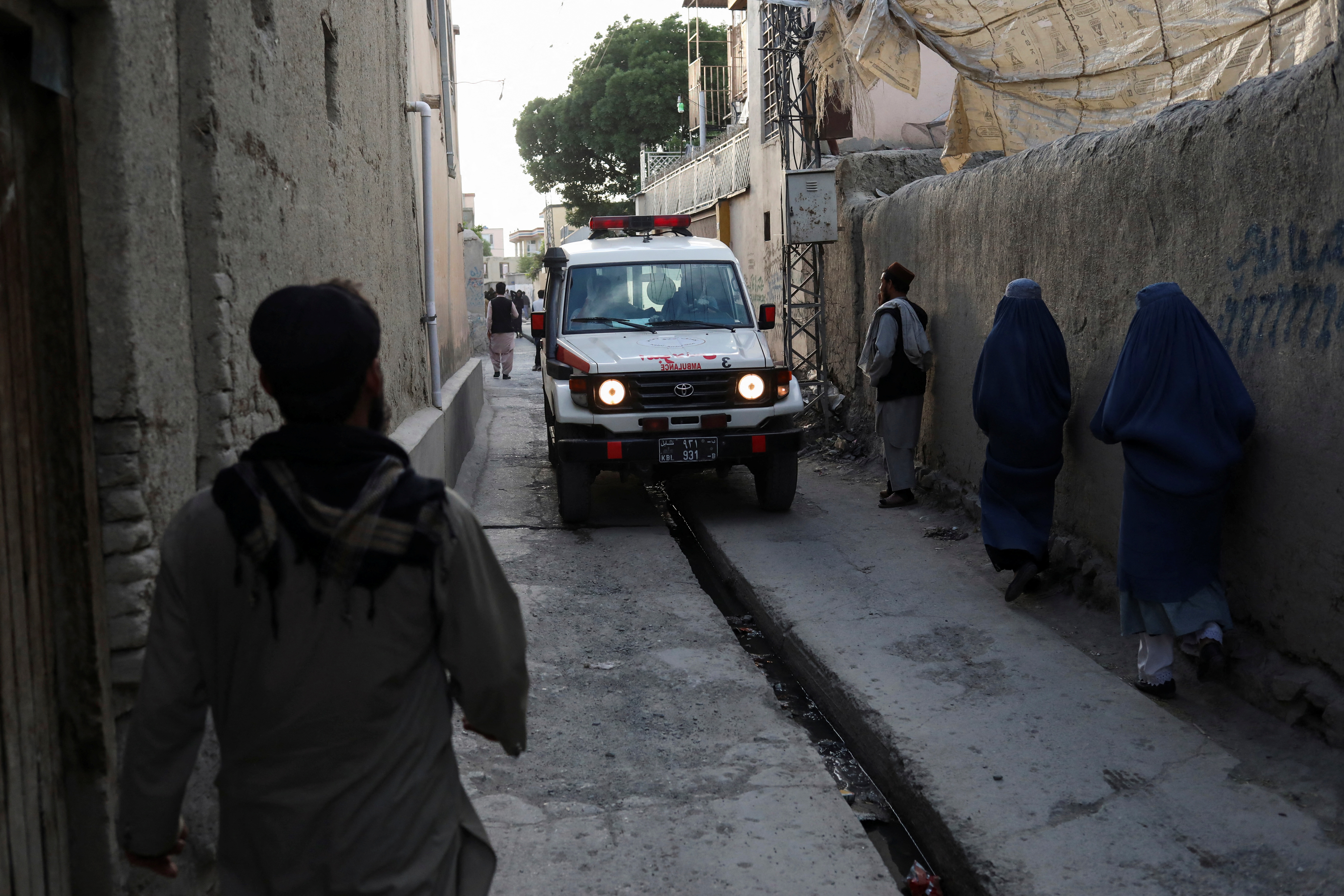 An Ambulance is seen near the site of explosions at Khalifa Sahib Mosque in Kabul