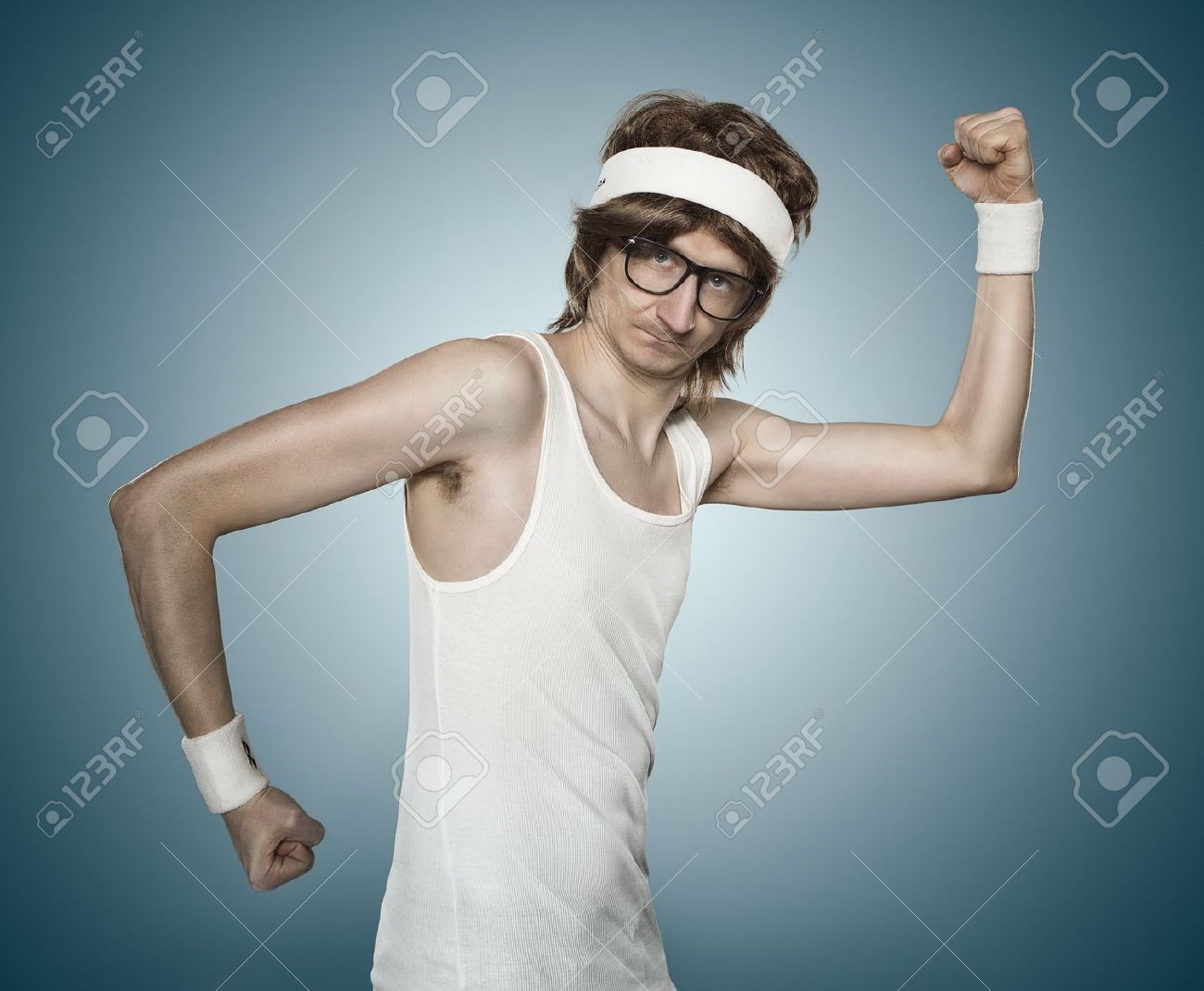 17850356-Funny-retro-sports-nerd-flexing-his-muscle-over-blue-background-Stock-Photo.jpg