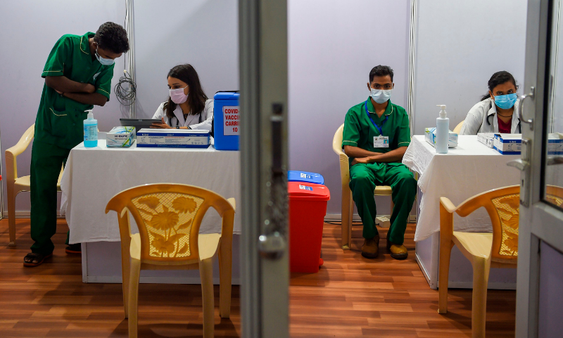 Medical staff work inside a Covid-19 vaccination centre in Mumbai on January 15, 2021, a day before India starts the first phase of vaccination across the country. — AFP