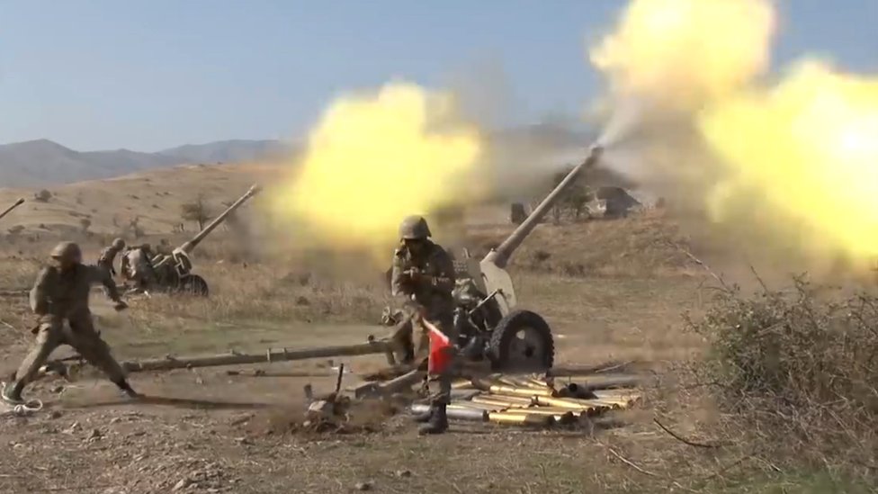 A still image taken from video footage published 20 October 2020 on the official website of the Azerbaijan's Defence Ministry shows allegedly artillery units of the Azerbaijani army fire during military combat with forces of the Nagorno-Karabakh's Defence Ministry shows allegedly artillery units of the Azerbaijani army fire during military combat with forces of the Nagorno-Karabakh