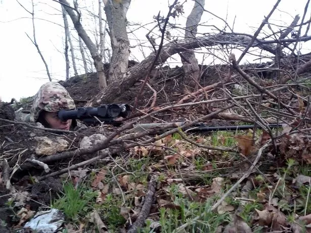 Olena Bilzerska Ukrainian sniper. At the sniper position Vodyane near Mariupol.