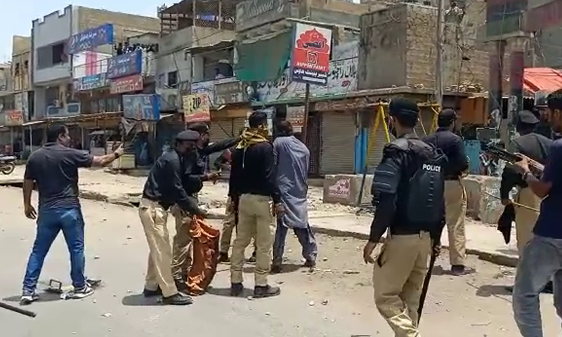 Police baton charge protesters at Mauripur Road in Karachi. — DawnNewsTV