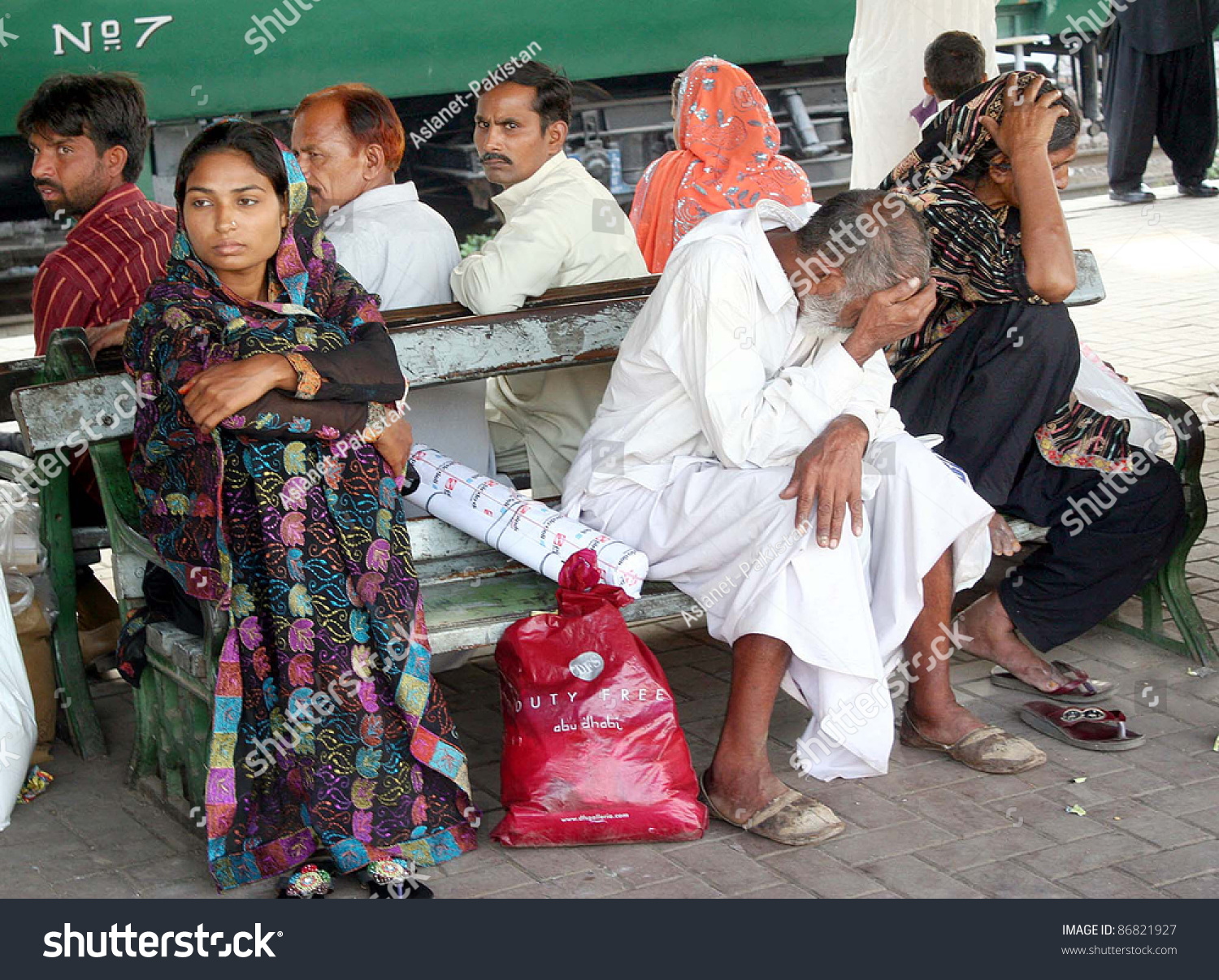 stock-photo-lahore-pakistan-oct-passengers-seen-worried-at-lahore-railway-station-due-to-protest-of-86821927.jpg