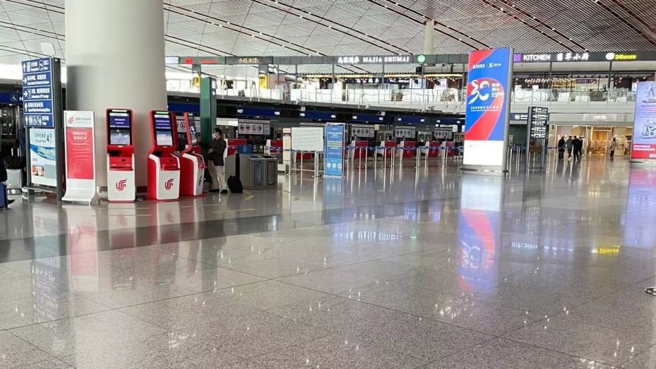 Beijing Capital International Airport's Terminal 3 stands far emptier than usual on the afternoon of Tuesday, Nov. 2, 2021.