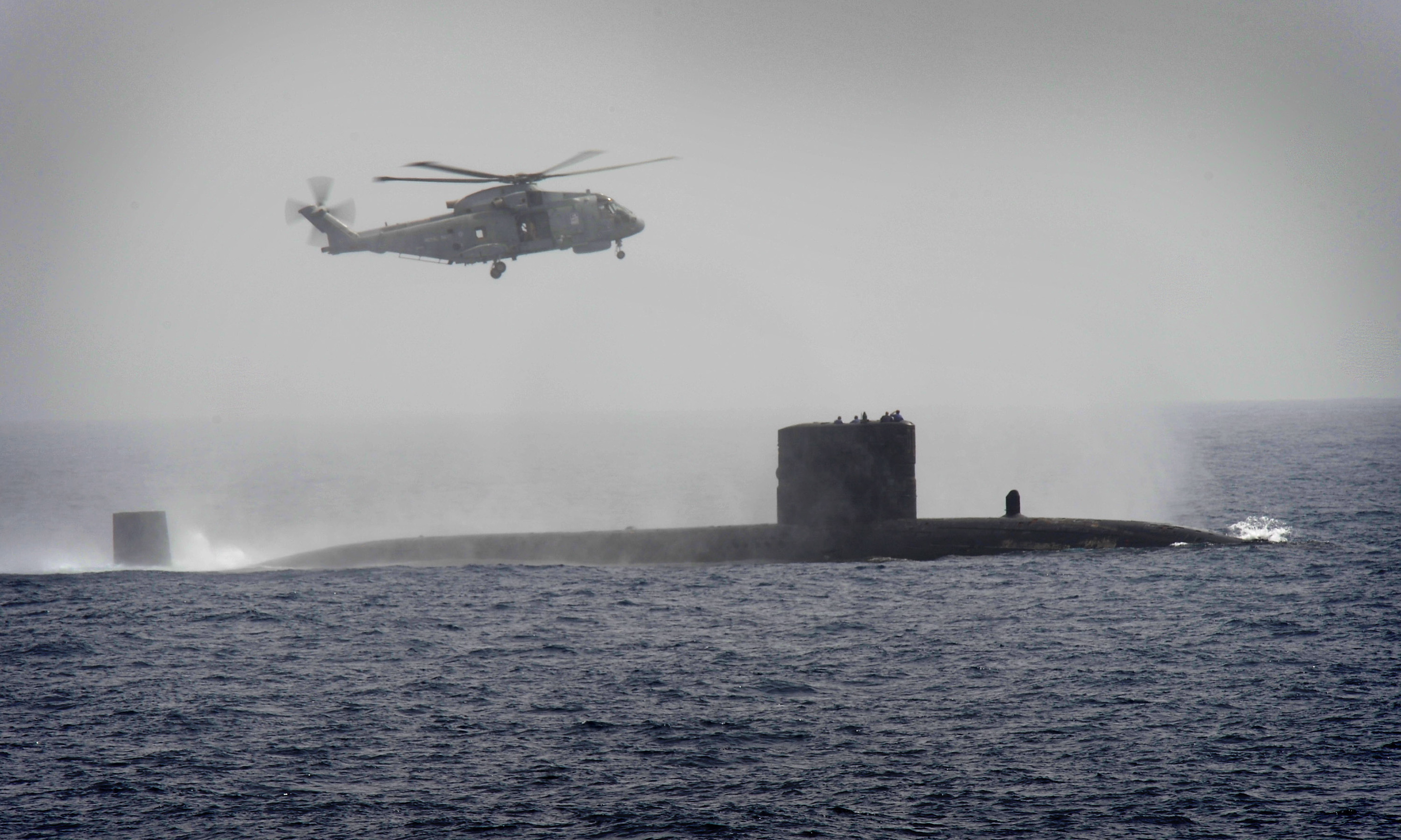 Royal_Navy_Submarine_HMS_Turbulent_with_a_Merlin_Helicopter_from_HMS_St_Albans_MOD_45153520.jpg