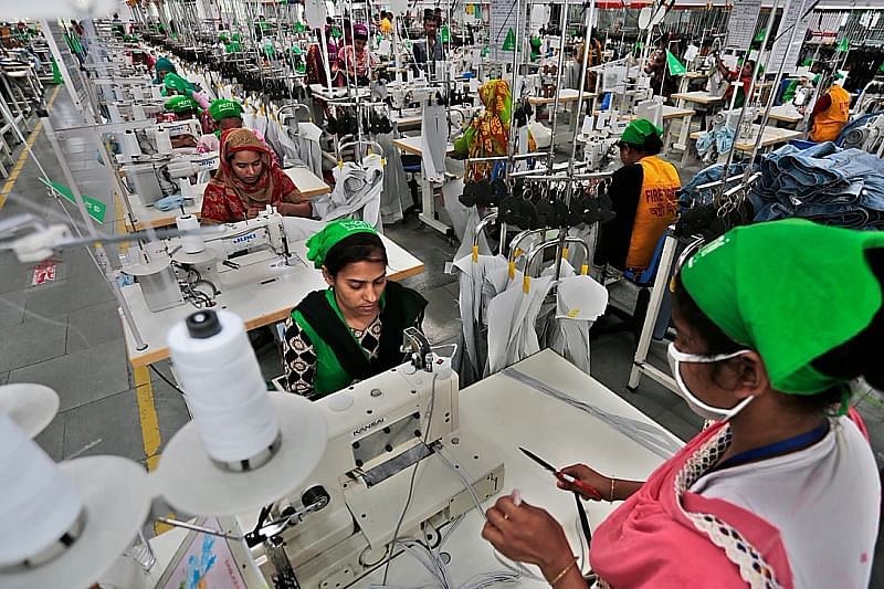 This file photo shows workers working at an apparel factory. 