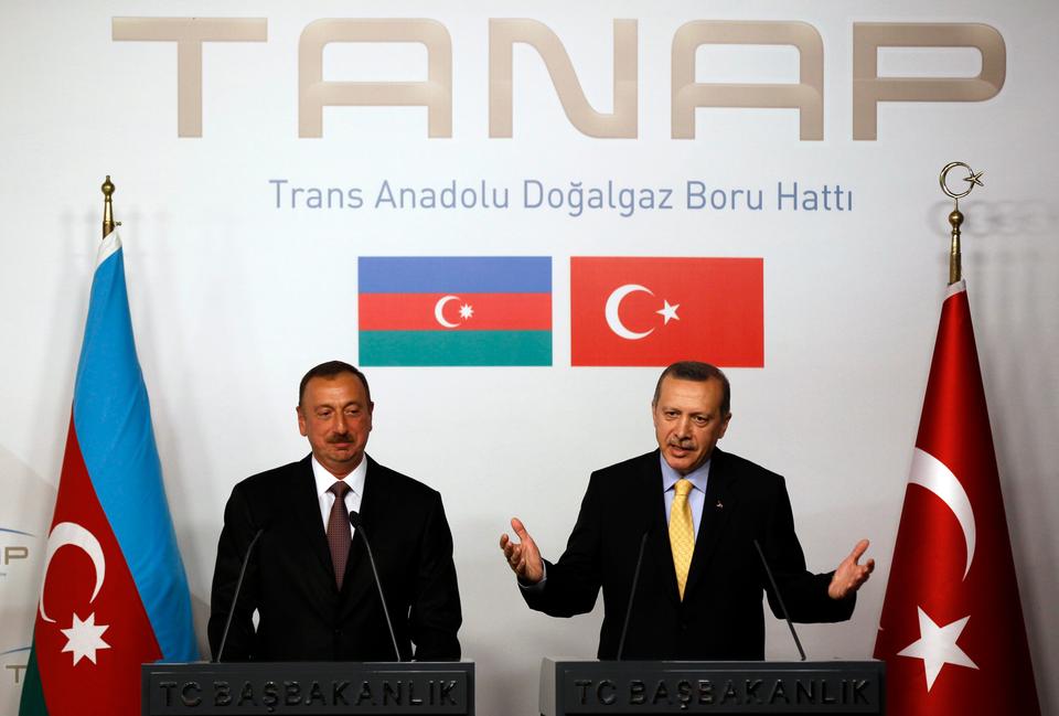 Turkey's Prime Minister Tayyip Erdogan (R) speaks as Azerbaijan's President Ilham Aliyev listens during a news conference following a signing ceremony in Istanbul June 26, 2012. Turkey and Azerbaijan signed an inter-governmental agreement on Tuesday on the $7 billion Trans-Anatolian natural gas pipeline project (TANAP), planned to carry Azeri natural gas across Turkey to Europe.