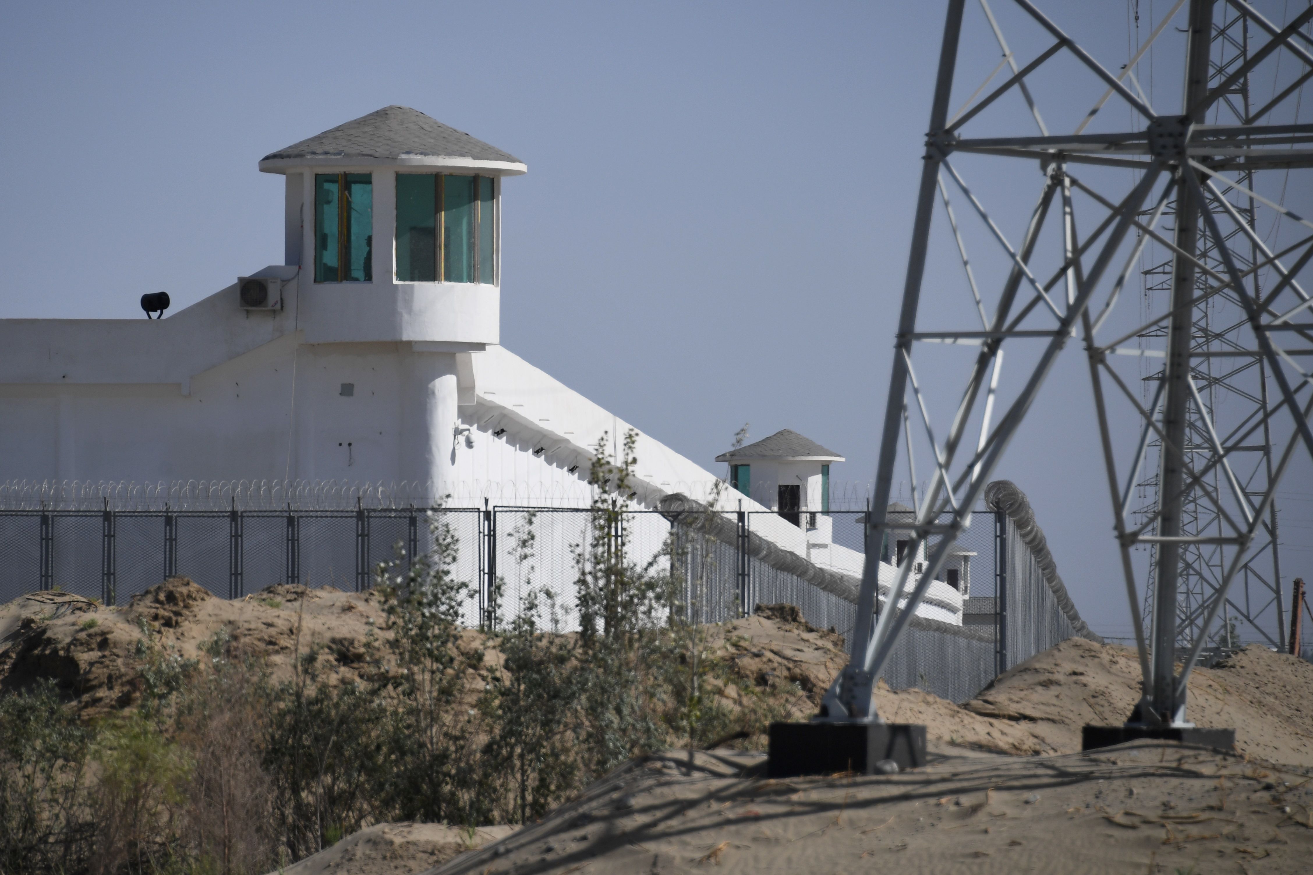Watchtowers on a high-security facility near what is believed to be a re-education camp where mostly Muslim ethnic minority Uighurs are detained, on the outskirts of Hotan, Xinjiang 