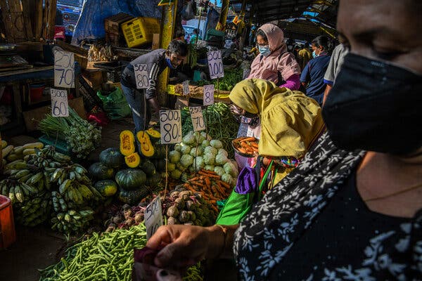 People buying vegetables  in Colombo this month. Food prices have risen to exorbitant heights recently. 