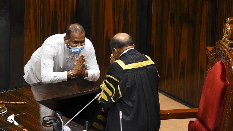 Convicted MP gestures after sworn in as a member of parliament [Ishara S Kodikara/AFP