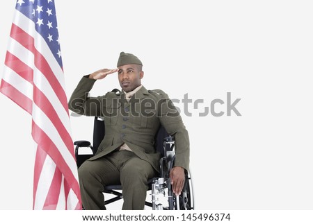 stock-photo-young-us-soldier-in-wheelchair-saluting-american-flag-over-gray-background-145496374.jpg